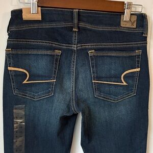 American Eagle Outfitters Dark Blue Boot Cut Jeans with Tan Stitching